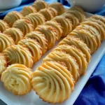 Homemade Milky Coconut Biscuits Recipe with golden edges and visible coconut flakes